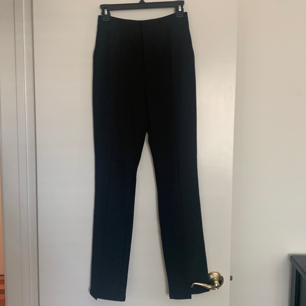 Black high waist trousers with slight slit at ankle
